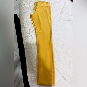 Gold color leggings with zipper in Small. Great condition wore 2 times